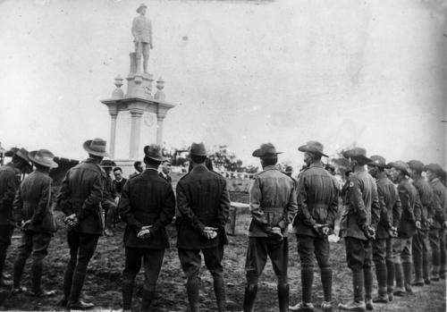 Returned soldiers in uniform surrounding the Digger War Memorial in Chinchilla ca. 1920