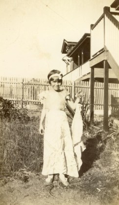 Mum in fancy dress. That's a train she's holding up.