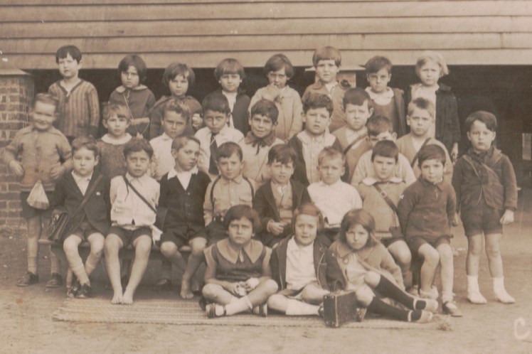 Kelvin Grove State School c1930. My father is in the 2nd back row looking rather pugnacious.