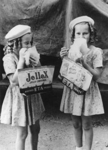 Two young girls enjoying their show bags. Copyright expired, SLQ bishop.slq.qld.gov.au:139717