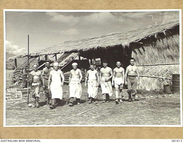 AWM Image 061613 of the 4th Field Bakery men leaving the bush materials bakehouse at Dumpu in the Ramu Valley, PNG.