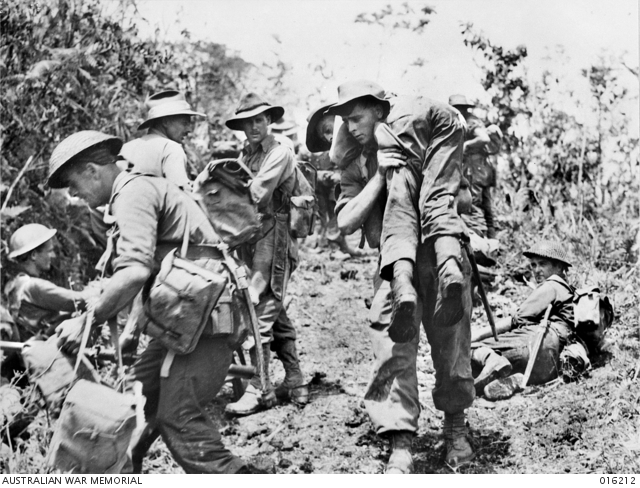 Australian troops moved in behind Matilda tanks for a dawn attack on the Japanese held village of Sattelberg. A wounded soldier is carried back to a dressing station on the shoulders of a soldier. http://trove.nla.gov.au/work/165056323