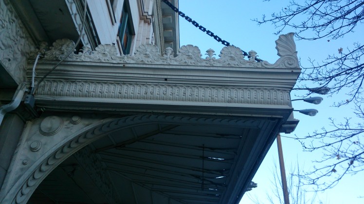 Check out the faces framing the awning.